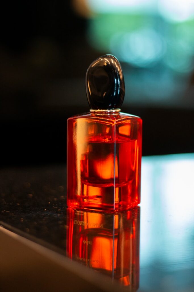 a bottle of perfume sitting on top of a table
